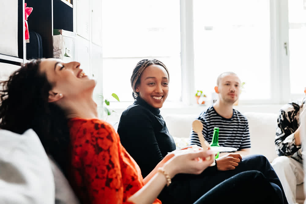 Employee sitting laughing