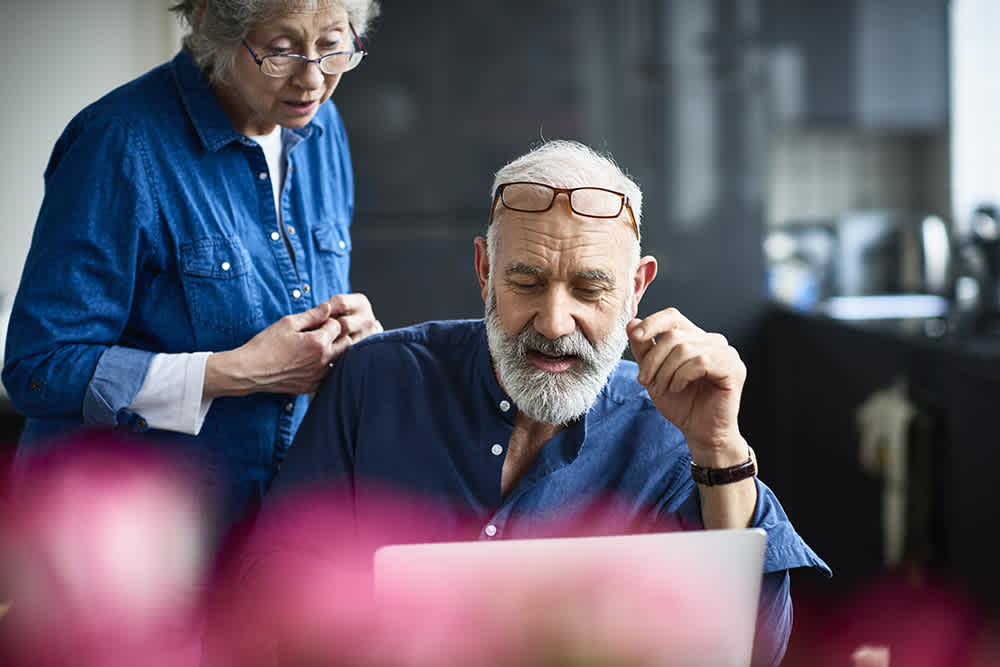 two people discussing laptop details