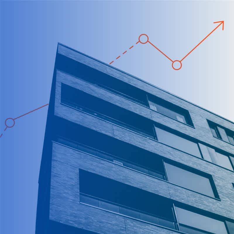 A modern apartment building seen from below, overlaid with a red upward-trending line graph on a blue gradient background, symbolizing growth or rising trends in real estate.