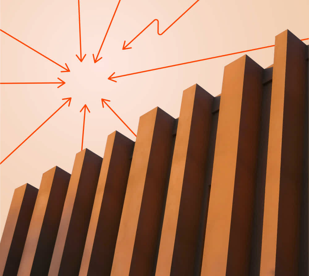 A row of tall, vertical, rectangular columns against a peach-colored sky, with multiple red arrows and lines drawn above them converging toward a central point in the sky.