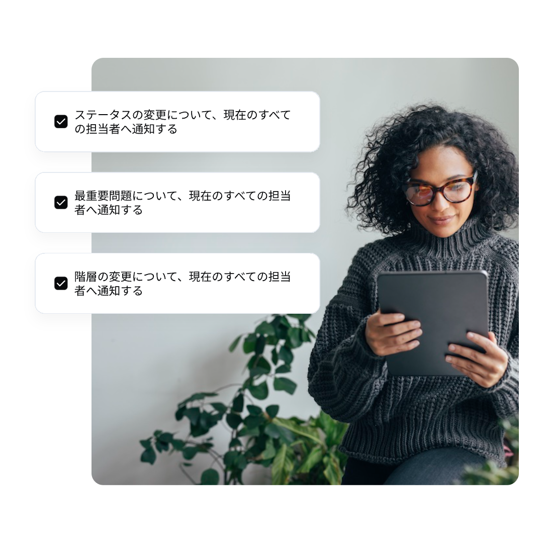 A woman with curly hair and glasses sits and looks at a tablet. Beside her are three Japanese text boxes from NAVEX One EthicsPoint with checkmarks, indicating completed tasks.