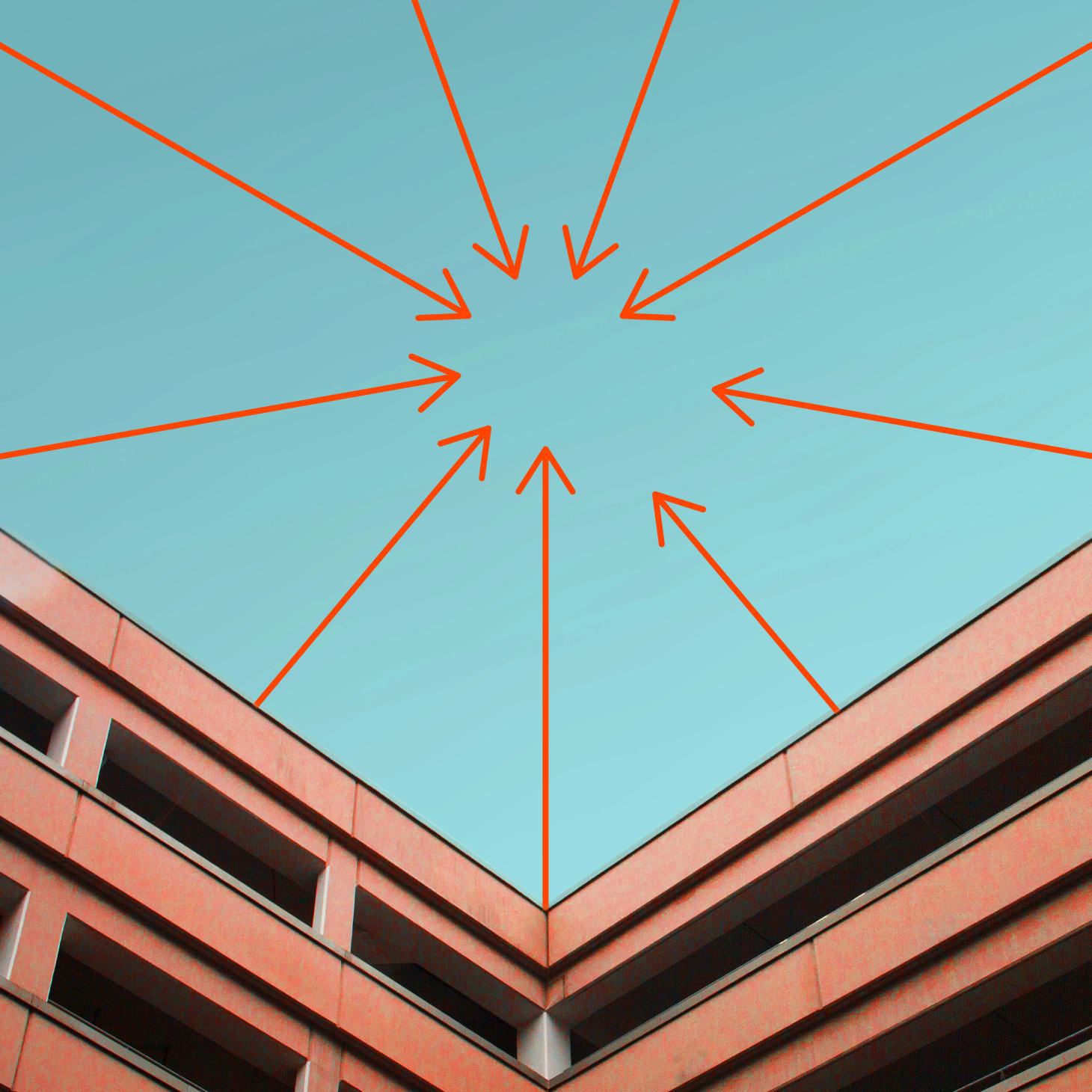 NAVEX arrows on blue sky brick building