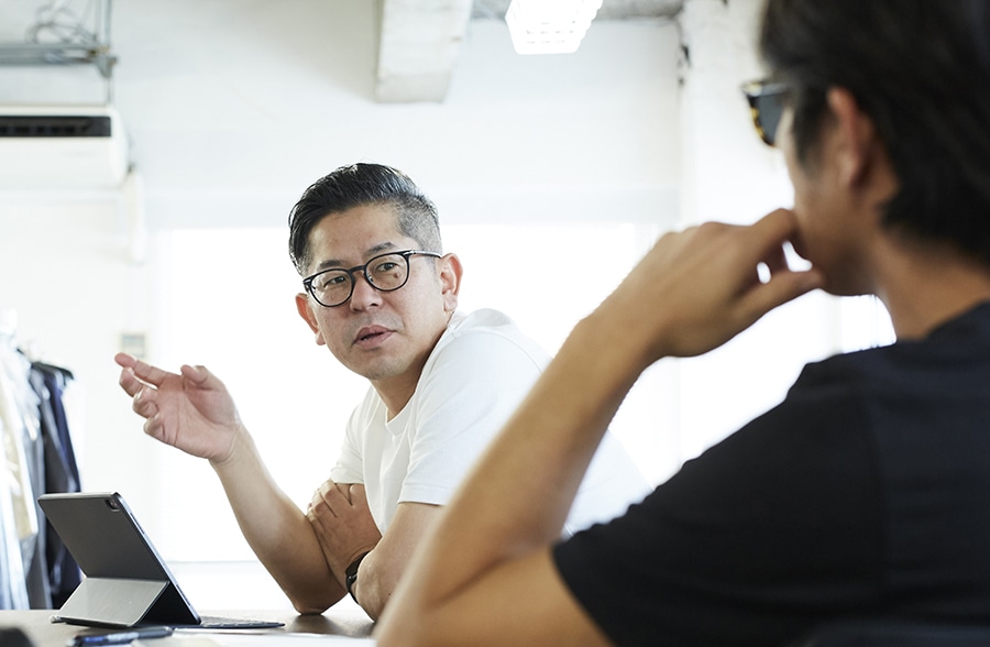 two Japanese coworkers working together at the office 
