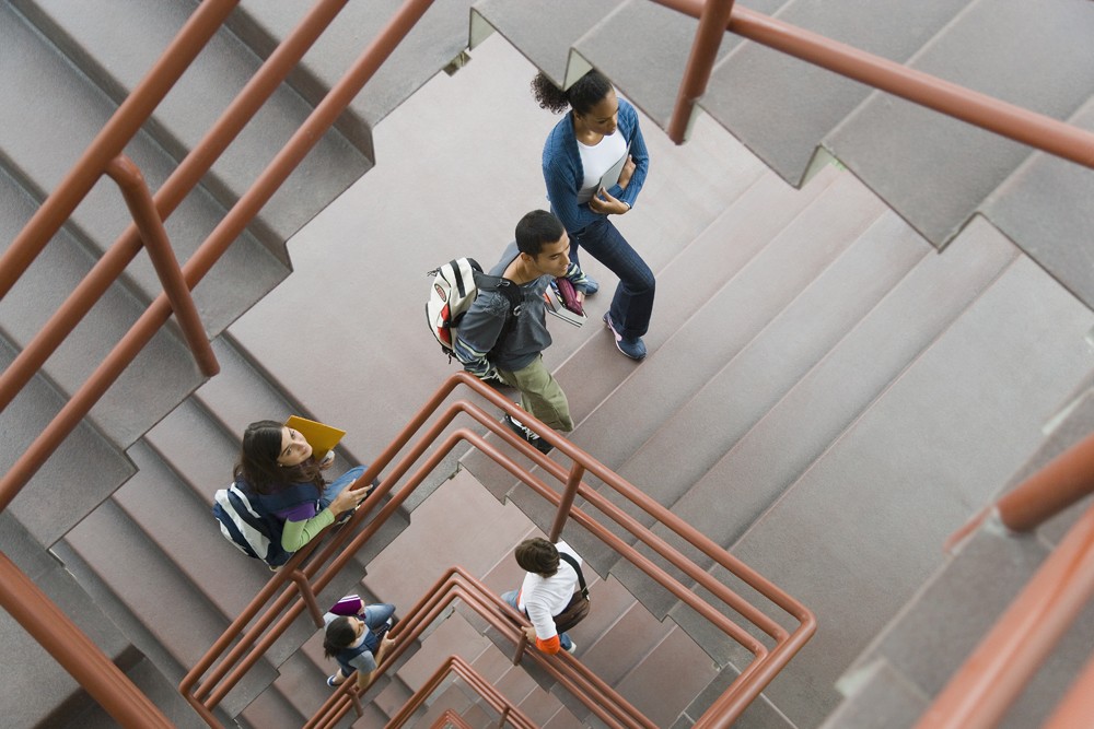 people walking up a staircase