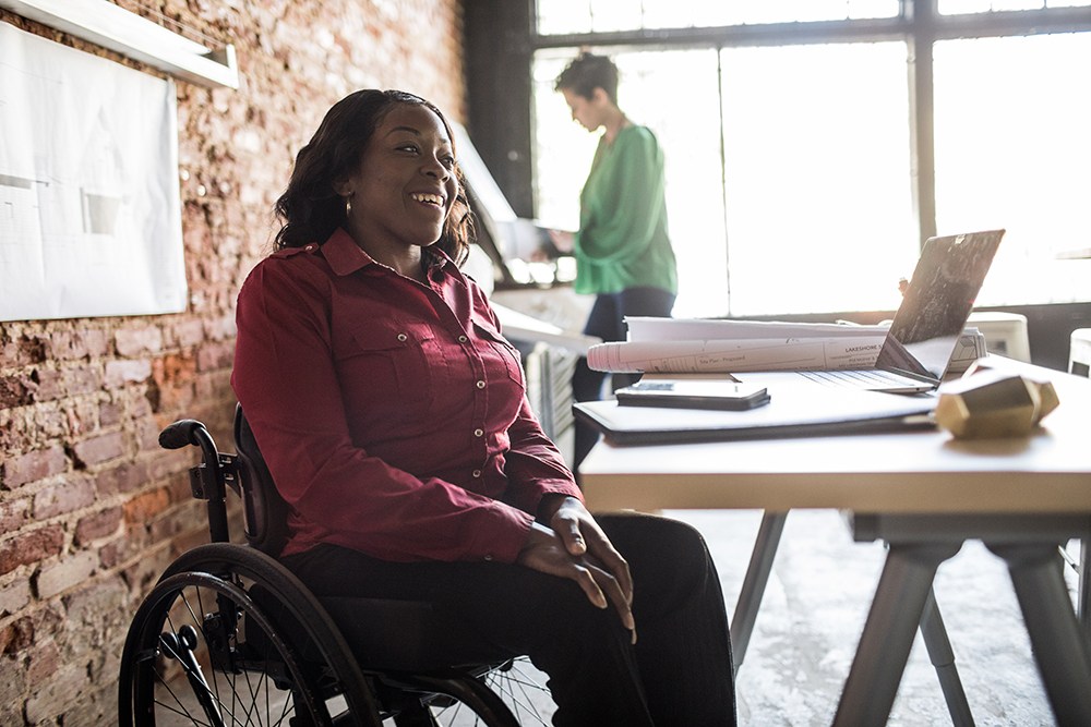 Woman in wheelchair at desk