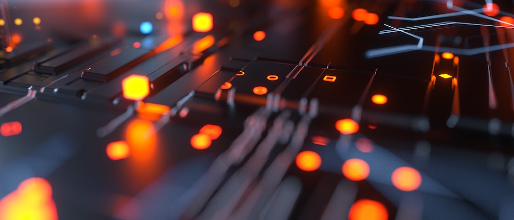 A close-up view of a dark, abstract circuit board with glowing orange and red lights, creating a futuristic and technological atmosphere.