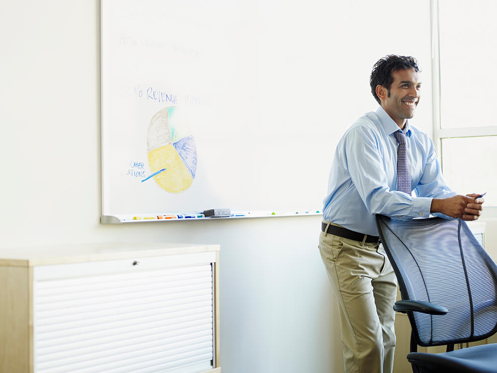 Man smiling in an office