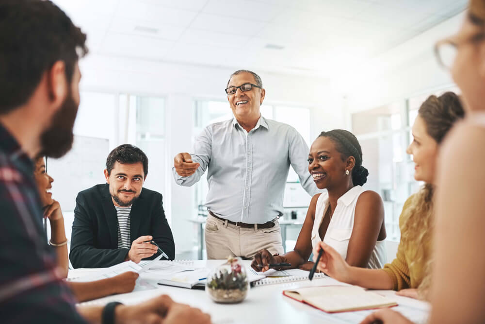 multigenerational, diverse team of coworkers in a meeting - close-up 