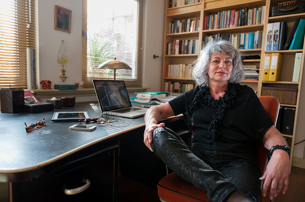 strong middle aged woman in office chair