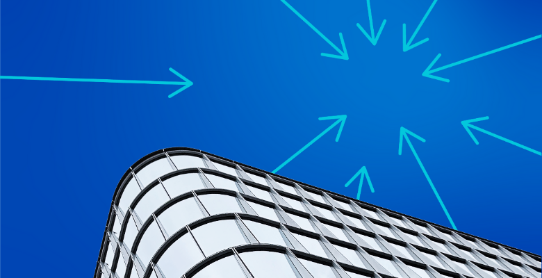 A modern glass building with rounded corners is shown against a blue sky, with several bright blue arrows pointing inward toward a central spot in the sky above the building.