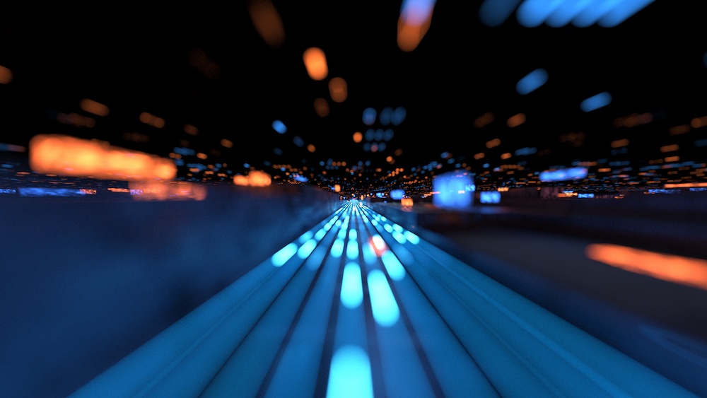 Abstract image showing blue and orange light streaks converging toward a vanishing point, creating a sense of speed and motion against a dark background.