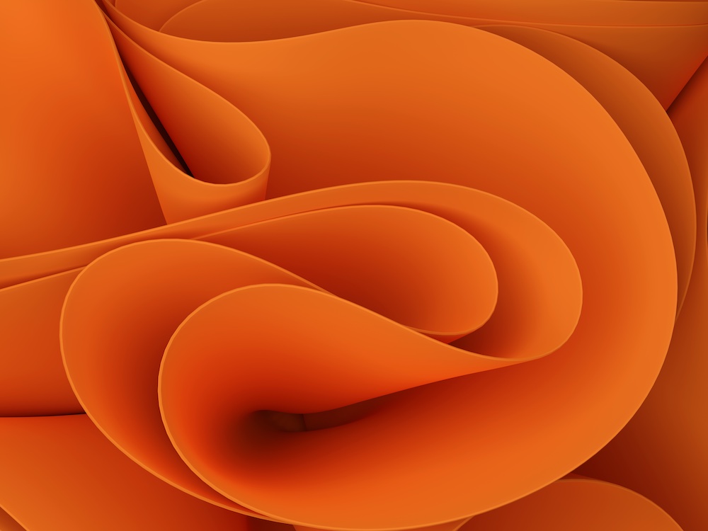 Abstract image of smooth, flowing orange shapes layered and curled, resembling petals or waves, creating a soft, dynamic, and fluid composition.